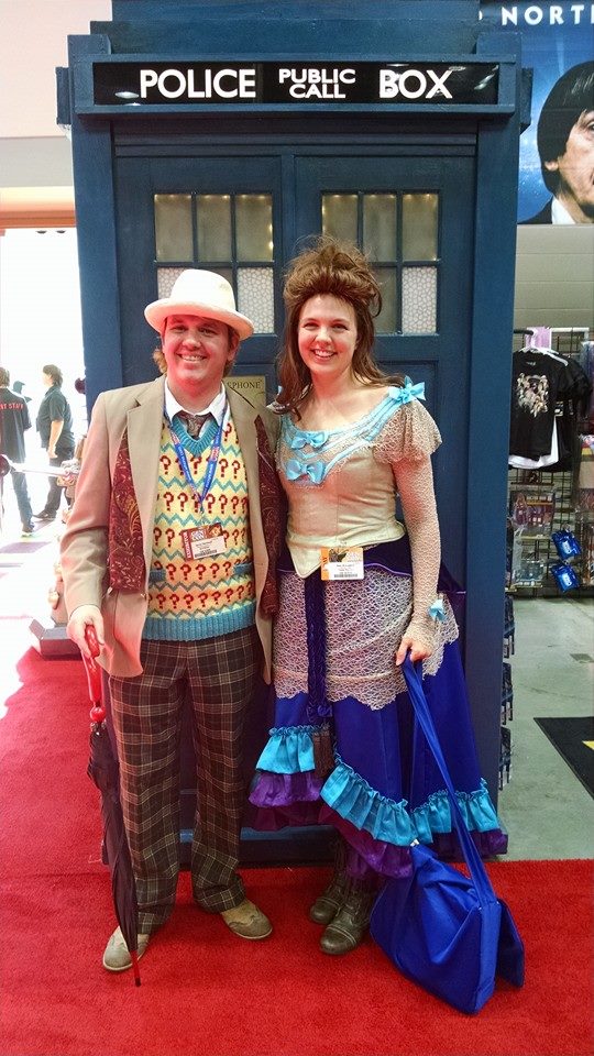 Picture of Mary dressed as Idris from Doctor Who with a man dressed as one of the Doctors in front of the TARDIS