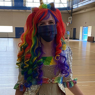 Picture of Mary dressed as a "sparkly rainbow unicorn"