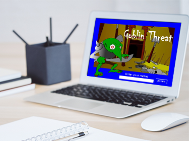 Start page of "Goblin Threat" tutorial game shown on a laptop